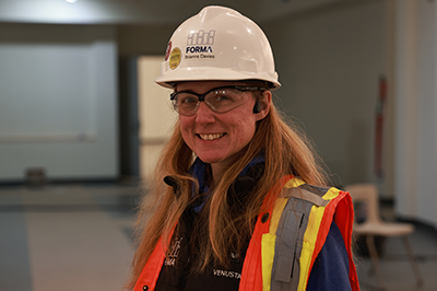 student in safety vest and hard hat