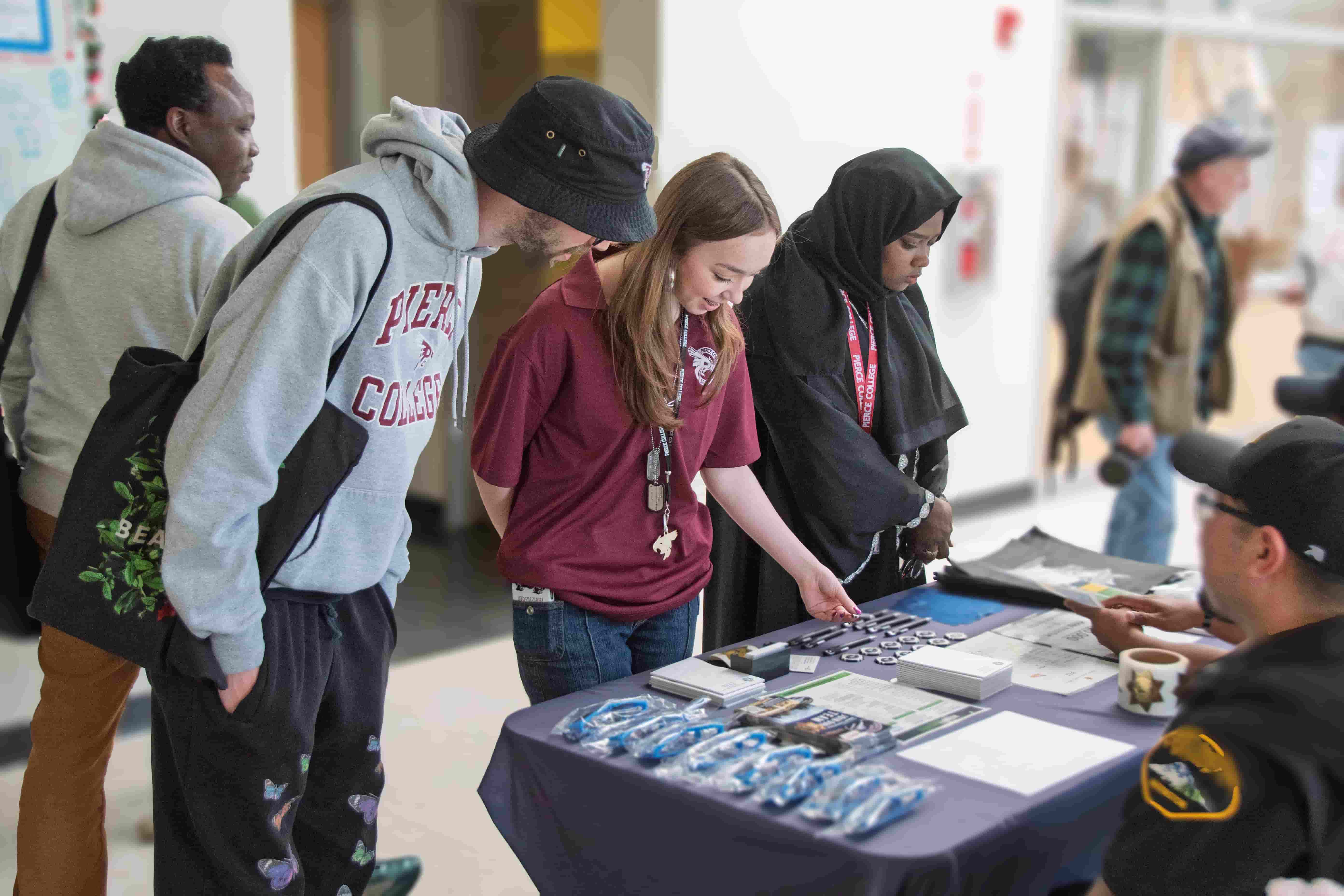Pierce College Student Life leaders explore tables at the 2025 Spring Job Fair at Pierce College Puyallup