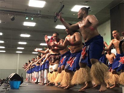 Group of dancers performing in traditional clothing