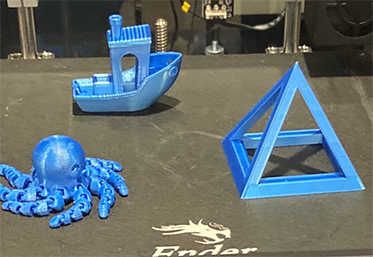 3d printed octopus, boat and pyramid