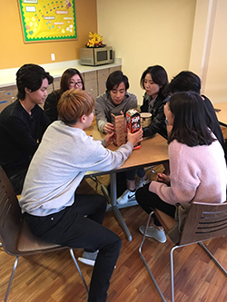 students playing game in residence hall kitchen