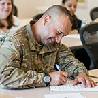 Military student happily studying