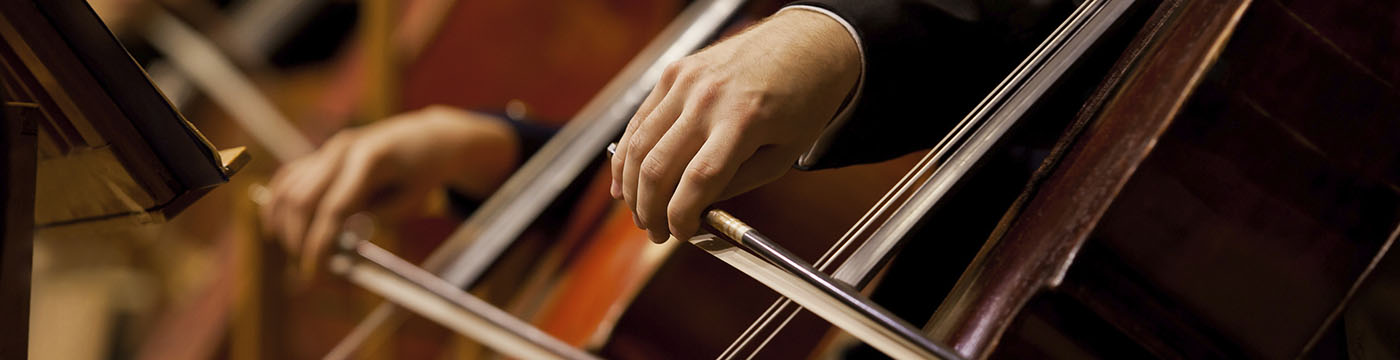 view of hands playing cellos