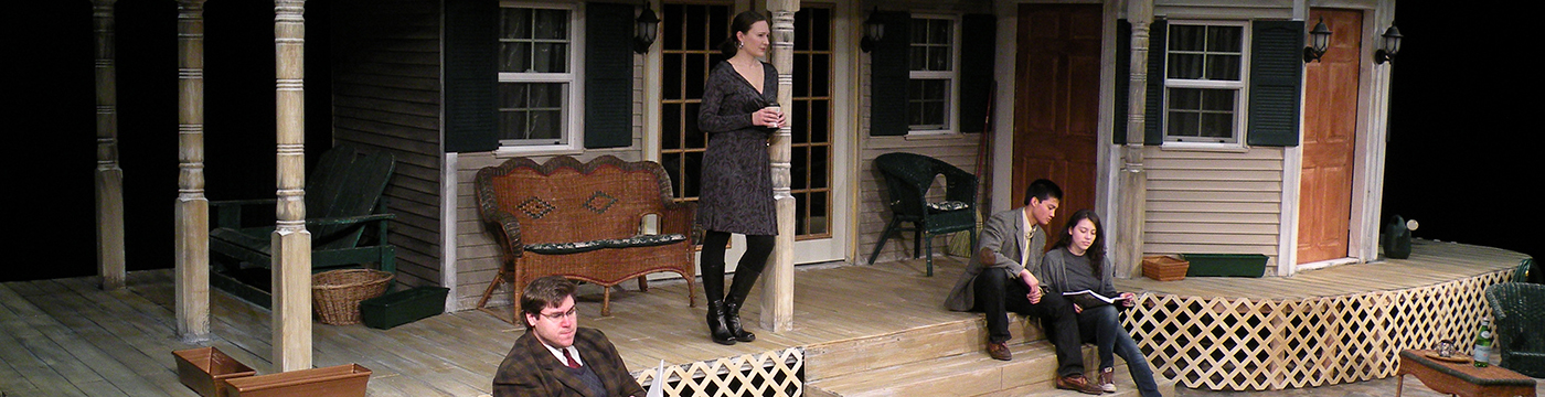 actors on a theatre set of a house porch